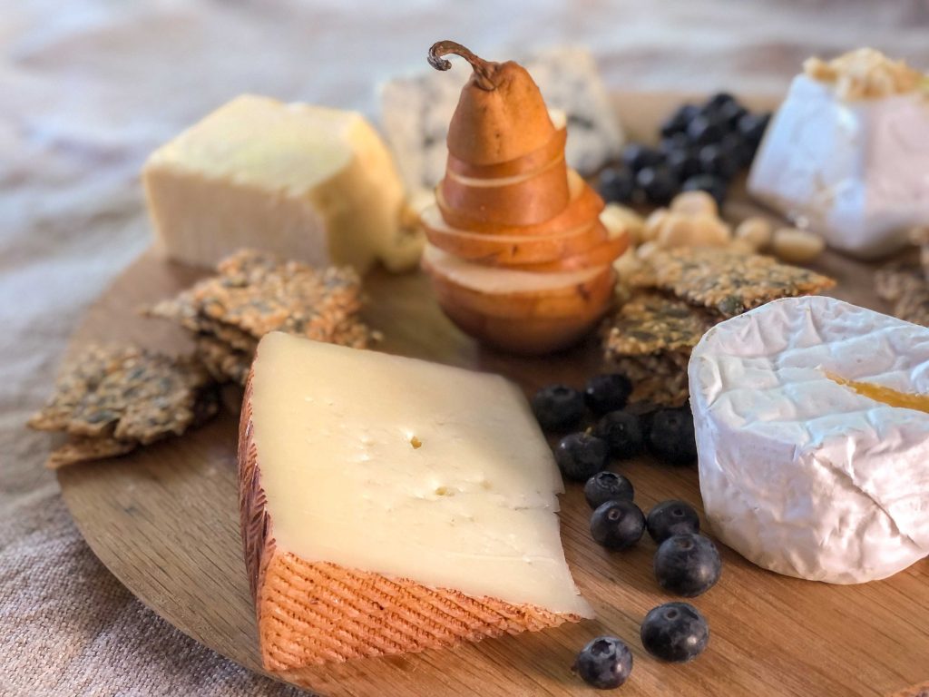 Manchego cheese on a cheeseboard