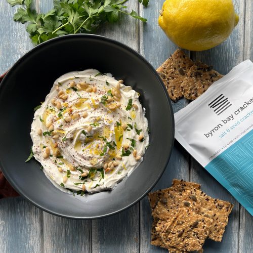 Bowl of whipped feta dip with Byron Bay Crackers
