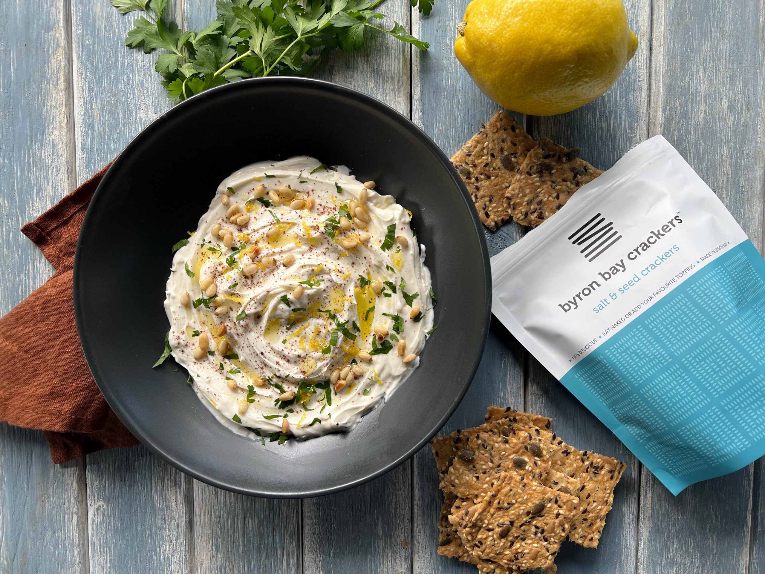 Bowl of whipped feta dip with Byron Bay Crackers
